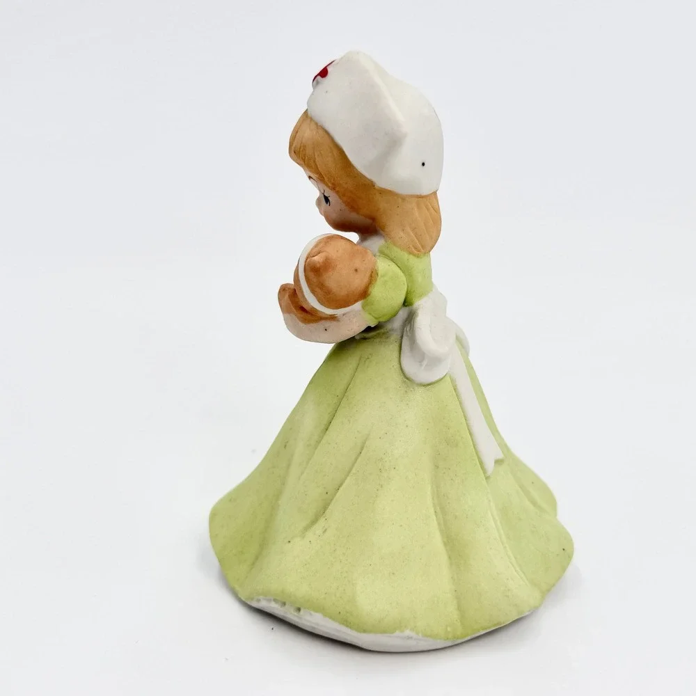 Vintage Japan Porcelain Nurse Figurine Green Dress Holding Teddy Bear Bisque - Picture 2 of 7